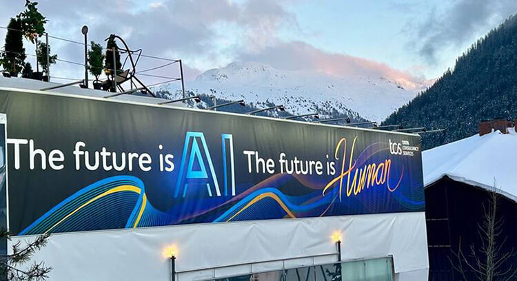 Image of Davos event - The future is AI the future is Human poster in front of mountains