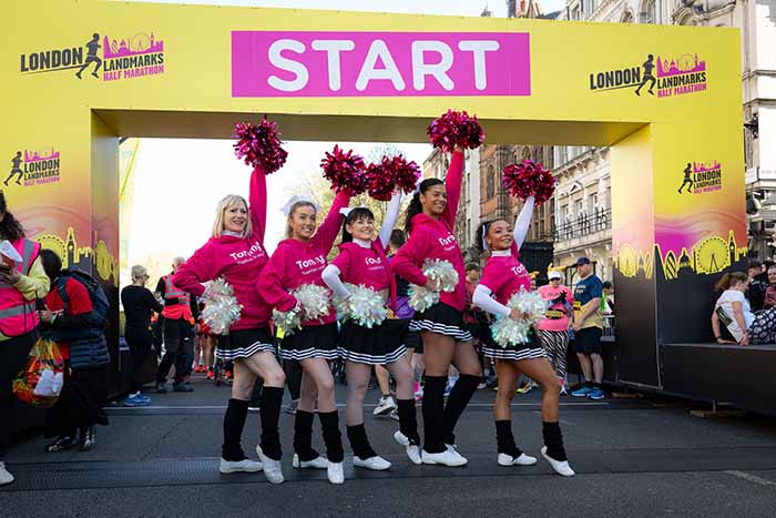 Image of cheerleaders in front of the start line