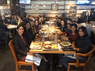 Wendy Wang with women sharing a table at a restaurant